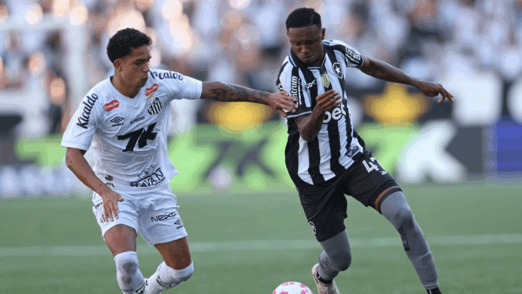 Jogadores de Santos e Botafogo disputam a bola durante a partida