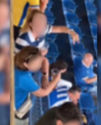 Print do vídeo em que aparece a torcedora, na arquibancada, xingando torcedores do Remo. Os rostos de todas as pessoas que aparecem no vídeo estão borrados.