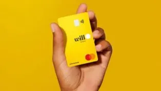 Mão segurando cartão do Will Bank