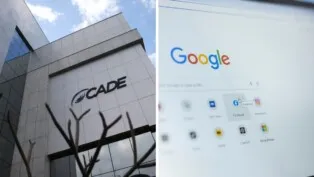 No lado esquerdo da foto há um prédio cinza e do lado direito há uma tela de computador.