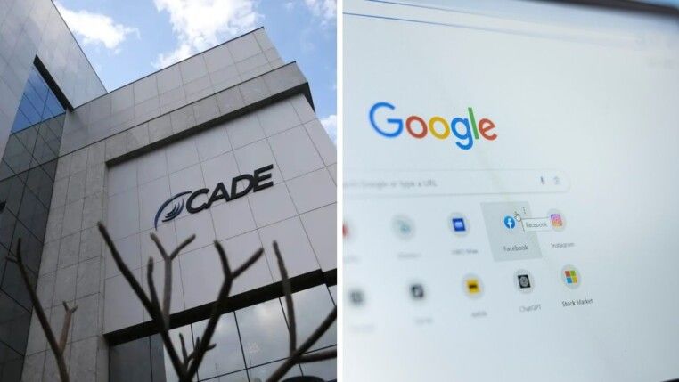 No lado esquerdo da foto há um prédio cinza e do lado direito há uma tela de computador.