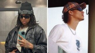 Dois homens estão na foto. No lado direito o homem usa camiseta branca e boné. Do lado esquerdo o homem usa jaqueta preta.