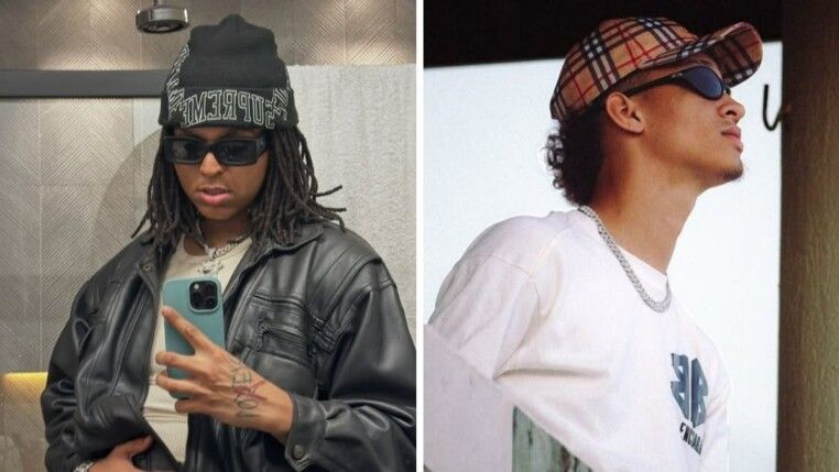 Dois homens estão na foto. No lado direito o homem usa camiseta branca e boné. Do lado esquerdo o homem usa jaqueta preta.