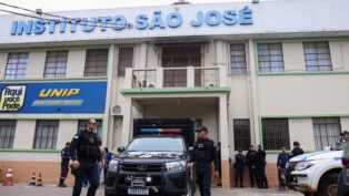 Policemen patrol after a shooting at the Sao Jose school, where two staff members were killed, the Acre state government confirmed in a statement, in Rio Branco, Brazil, May 5, 2026. REUTERS/Sergio Vale