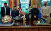 U.S. President Donald Trump shows an image of the concept for the Ultimate Fighting Championship planned for June 14, 2026, as he holds an event with UFC fighters Alex Pereira, Ciryl Gane, Justin Gaethje and Ilia Topuria in the Oval Office at the White House in Washington, D.C., U.S., May 6, 2026. REUTERS/Kylie Cooper