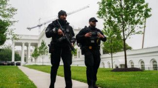U.S. Secret Service agents walk at the White House after alleged gunshots were heard nearby, at the White House in Washington, D.C., U.S., May 23, 2026. REUTERS/Nathan Howard