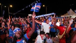 Soccer Football - FIFA World Cup 2026 - Group H - Cape Verde v Saudi Arabia - Fans gather in Praia - Praia, Cape Verde - June 27, 2026 Cape Verde fans celebrate progressing to the knockout stages after the match REUTERS/Sodiq Adelakun
