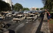 Parts of a helicopter lie on the ground following a collision between two helicopters in Rio de Janeiro People gather near charred vehicles following a deadly collision between two helicopters in Rio de Janeiro, Brazil, June 14, 2026. REUTERS/Ricardo Moraes