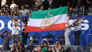 Soccer Football - FIFA World Cup 2026 - Group G - Iran v New Zealand - Los Angeles Stadium, Inglewood, California, U.S. - June 15, 2026 Iran fans display a pre-Iranian Revolution "Lion and Sun" flag in the stands REUTERS/Matthew Childs
