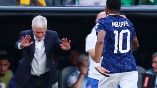 Soccer Football - FIFA World Cup 2026 - Round of 32 - France v Sweden - New York New Jersey Stadium, East Rutherford, New Jersey, U.S. - June 30, 2026 France's Kylian Mbappe with coach Didier Deschamps after being substituted IMAGN IMAGES via Reuters/Vincent Carchietta