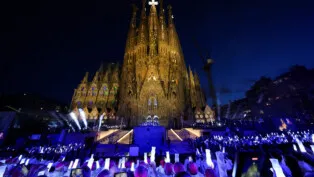 Members of the clargy hold lamps during the inauguration of the Tower of Jesus Christ and its blessing by Pope Leo XIV at the Basilica of the Sagrada Familia during his apostolic journey in Barcelona, Spain, June 10, 2026. REUTERS/Nacho Doce