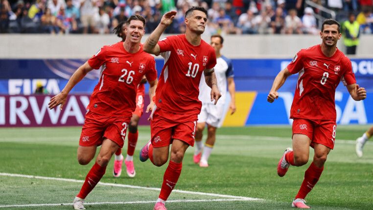 Soccer Football - FIFA World Cup 2026 - Group B - Switzerland v Bosnia and Herzegovina - Los Angeles Stadium, Inglewood, California, U.S. - June 18, 2026 Switzerland's Granit Xhaka celebrates scoring their fourth goal with Cedric Itten and Remo Freuler REUTERS/Daniel Cole