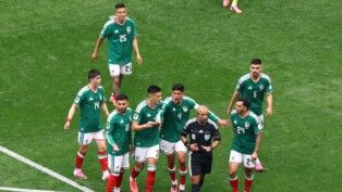 Soccer Football - FIFA World Cup 2026 - Group A - Mexico v South Africa - Estadio Azteca, Mexico City, Mexico - June 11, 2026 Mexico's Cesar Montes reacts after being shown a red card by referee Wilton Pereira Sampaio as teammates protest REUTERS/Raquel Cunha