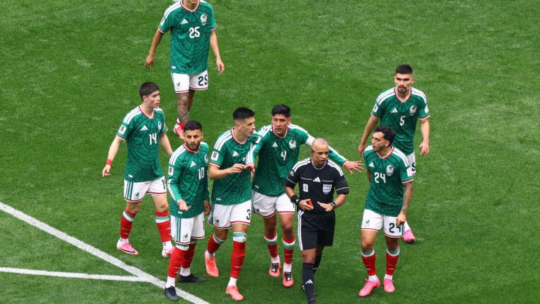 Soccer Football - FIFA World Cup 2026 - Group A - Mexico v South Africa - Estadio Azteca, Mexico City, Mexico - June 11, 2026 Mexico's Cesar Montes reacts after being shown a red card by referee Wilton Pereira Sampaio as teammates protest REUTERS/Raquel Cunha