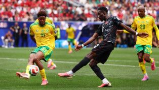 Soccer Football - FIFA World Cup 2026 - Round of 32 - South Africa v Canada - Los Angeles Stadium, Inglewood, California, U.S. - June 28, 2026 Canada's Tani Oluwaseyi in action with South Africa's Ime Okon IMAGN IMAGES via Reuters/Jessie Alcheh
