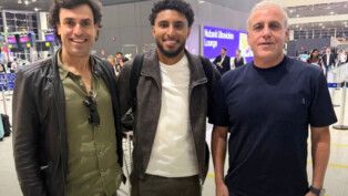 Éderson embarca para os EUA