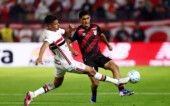 Brasileiro Championship - Sao Paulo v Athletico Paranaense Soccer Football - Brasileiro Championship - Sao Paulo v Athletico Paranaense - Estadio Municipal Cicero De Souza Marques, Braganca Paulista, Brazil - July 22, 2026 Athletico Paranaense's Claudinho in action with Sao Paulo's Lucas Ramon REUTERS/Jean Carniel
