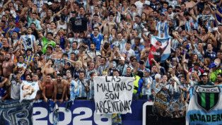 Soccer Football - FIFA World Cup 2026 - Semi Final - England v Argentina - Atlanta Stadium, Atlanta, Georgia, U.S. - July 15, 2026 Argentina fans display a banner with a message referencing the Falkland Islands as they celebrate after the match REUTERS/Paul Childs