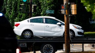 A vehicle involved in a shooting incident involving U.S. Immigration and Customs Enforcement (ICE) is towed from the scene in Biddeford, Maine, U.S., July 13, 2026. REUTERS/CJ Gunther