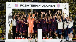 Soccer Football - DFL Supercup - Final - Borussia Dortmund v Bayern Munich - Signal Iduna Park, Dortmund, Germany - August 22, 2026 Bayern Munich's Manuel Neuer lifts the trophy with teammates after winning the DFL Supercup final REUTERS/Teresa Kroeger